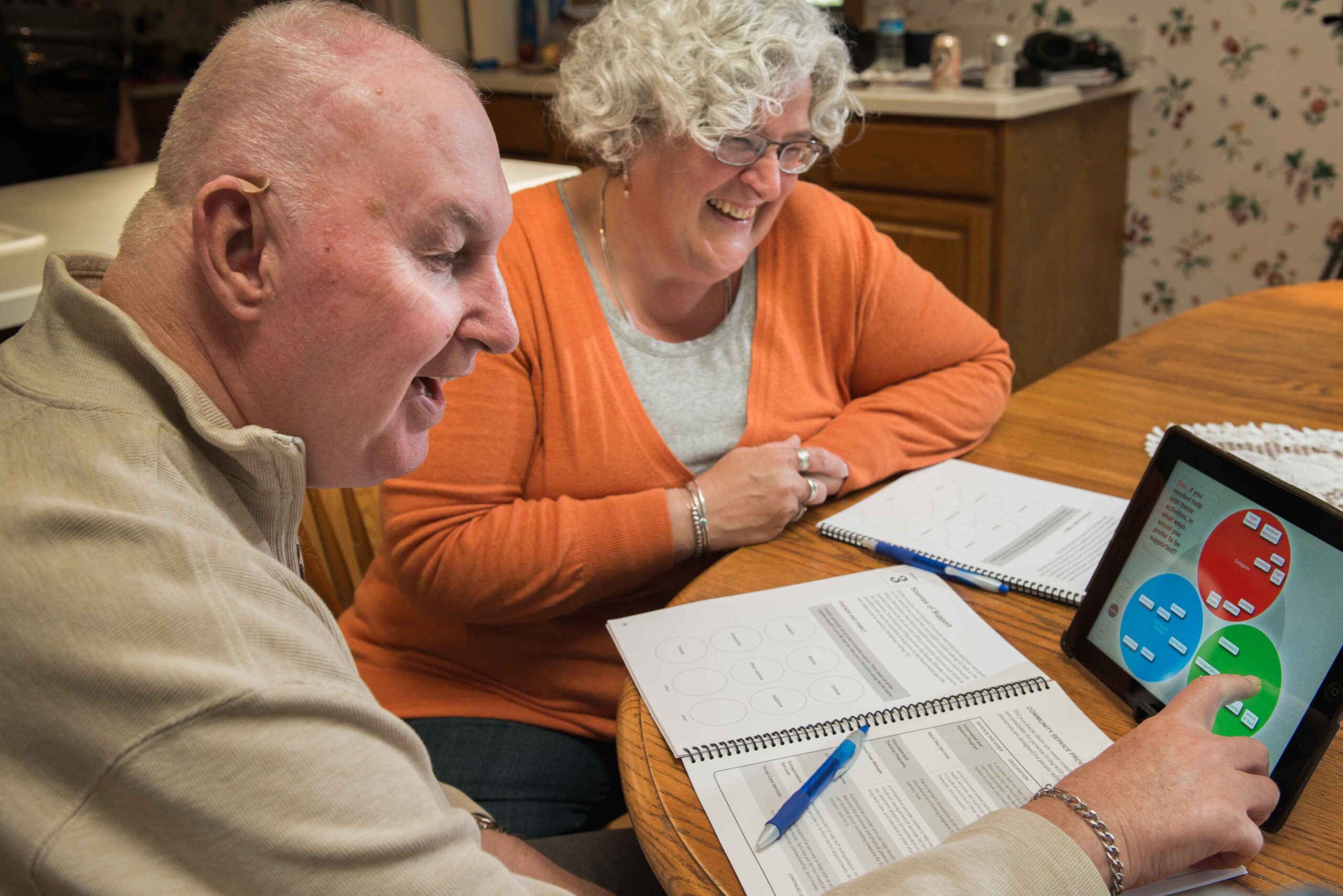 An older couple using the SHARE app